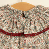 Vestido niña flores con cuello volante y puntilla granate