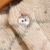 Chaqueta bebé punto greca pastel