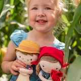 Rosa muñeca granjera con oveja