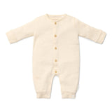Pelele pijama bebé crema
